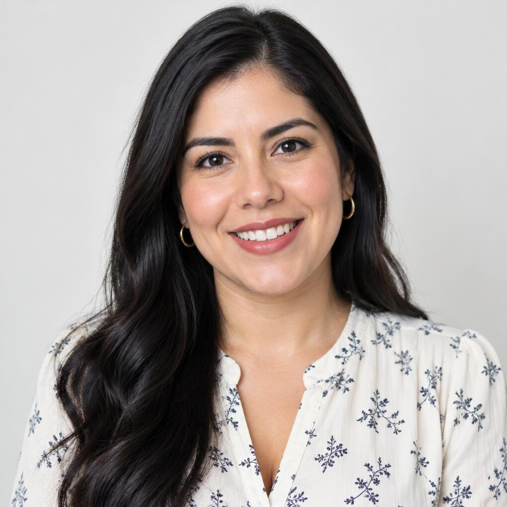 Portrait of a smiling Mexican woman in her thirties with long dark hair