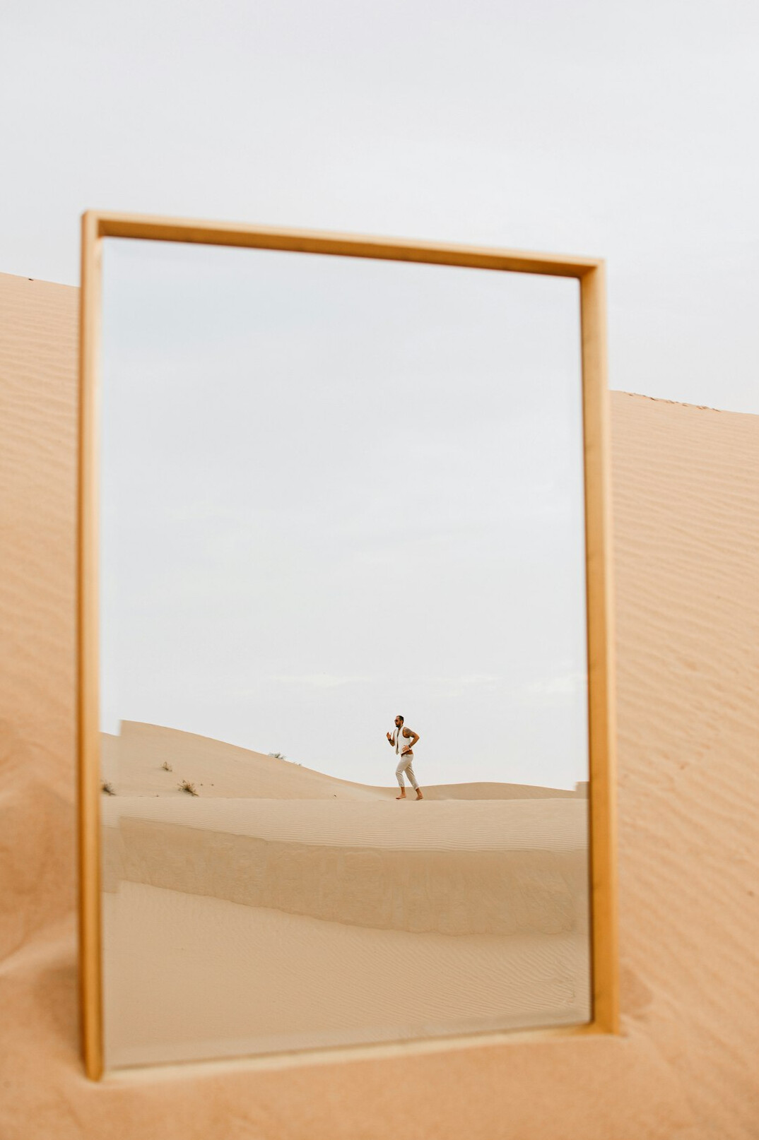 person reflecting in mirror